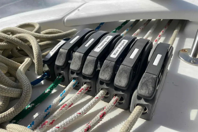 Slide: The Image of Close-up of rope clutches on a 2004 Beneteau Oceanis 473 sailboat deck. - 93