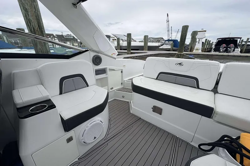 Slide: The Image of 2016 Monterey 298SS Super Sport boat interior with white seating and modern design. - 10