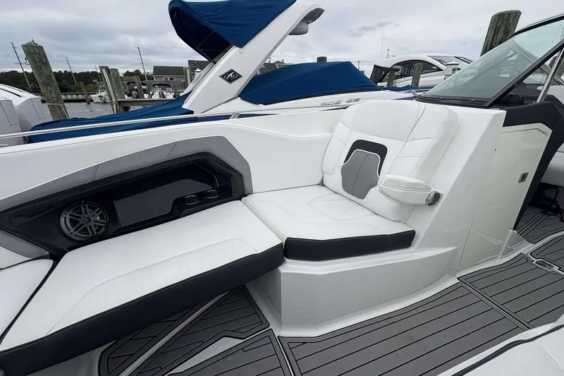Slide: The Image of 2016 Monterey 298SS Super Sport boat interior with white seating and sleek design. - 12