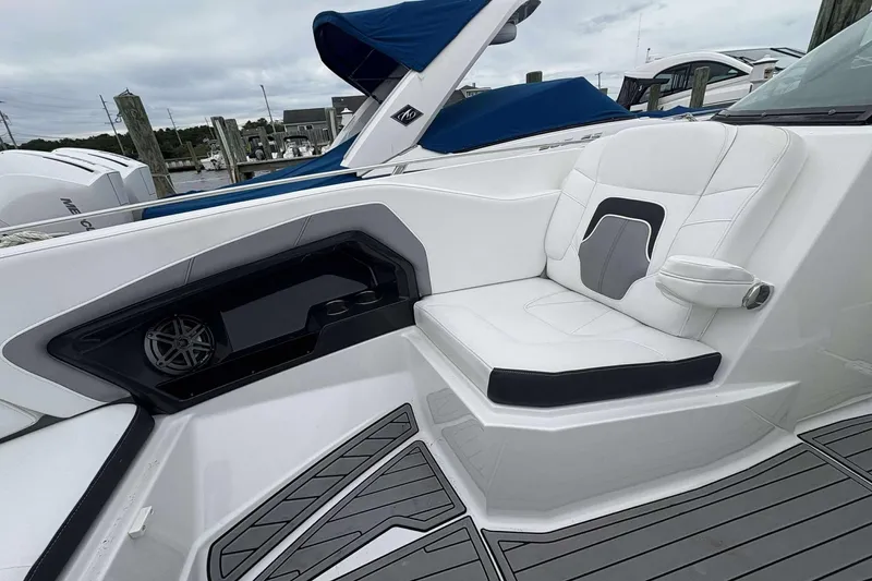 Slide: The Image of 2016 Monterey 298SS Super Sport boat interior with white seating and sleek design. - 13