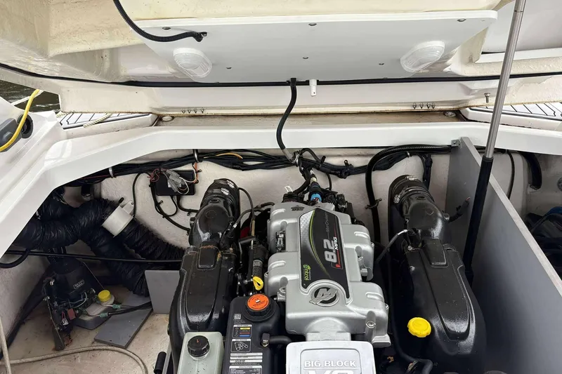Slide: The Image of Engine compartment of a 2016 Monterey 298SS Super Sport boat, showcasing the powerful motor. - 16