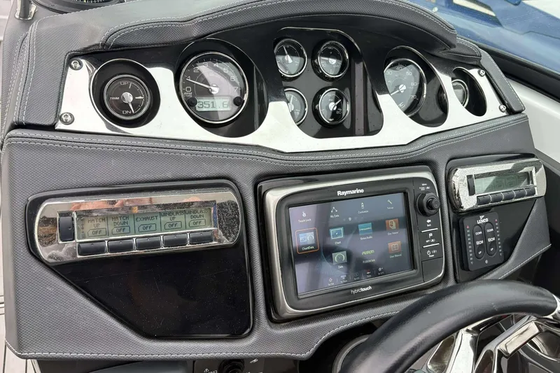 Slide: The Image of Dashboard of a 2016 Monterey 298SS Super Sport boat with navigation and control systems. - 20