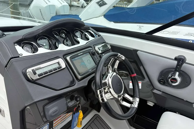 Slide: The Image of Cockpit of 2016 Monterey 298SS Super Sport boat with modern controls and navigation system. - 21