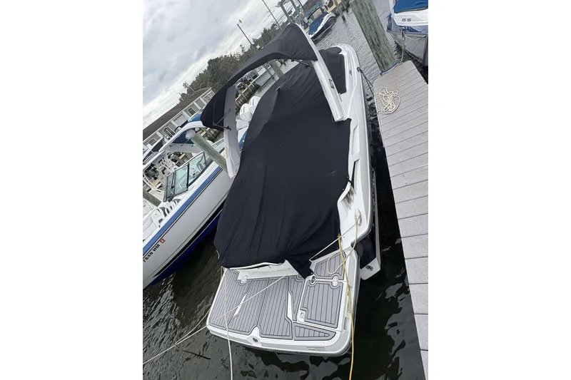 Slide: The Image of 2016 Monterey 298SS Super Sport boat docked with black cover. - 22