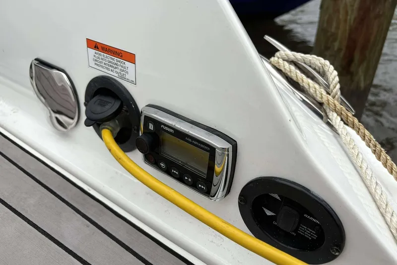 Slide: The Image of Close-up of 2016 Monterey 298SS Super Sport boat's control panel and power outlet. - 23