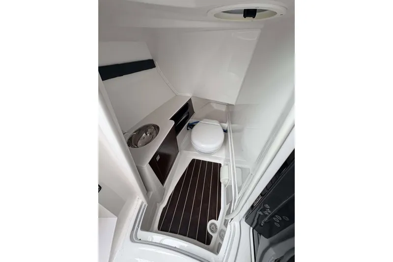 Slide: The Image of 2016 Monterey 298SS Super Sport boat interior bathroom with sink and toilet. - 6