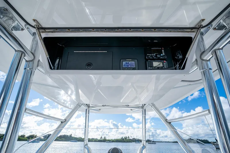 Slide: The Image of 2011 Bahama 37 boat electronics panel with ocean view and clear sky. - 12
