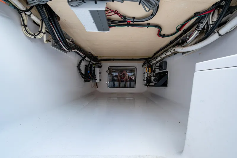 Slide: The Image of Interior view of 2011 Bahama 37 boat's wiring and equipment compartment. - 22