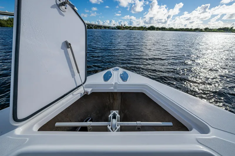 Slide: The Image of Open storage compartment on 2011 Bahama 37 boat, overlooking calm water and blue sky. - 7