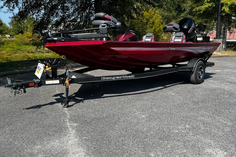 The Image of 2026 Ranger RT178 boat on trailer, red color, parked outdoors. - 1
