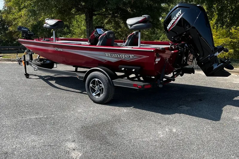Slide: The Image of 2026 Ranger RT178 boat with Mercury engine, parked on a trailer in a sunny outdoor setting. - 3
