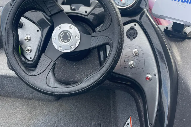 Slide: The Image of Steering wheel and controls of 2022 Tracker Pro Team 175 TXW boat. - 4