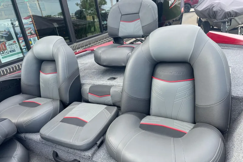 Slide: The Image of 2022 Tracker Pro Team 175 TXW boat seats with gray and red accents. - 6