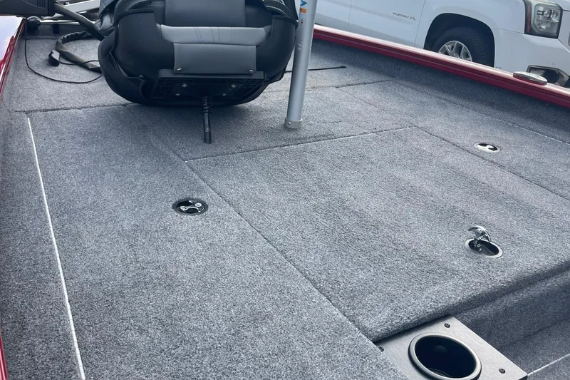 Slide: The Image of 2022 Tracker Pro Team 175 TXW boat deck with gray carpet and seating. - 7