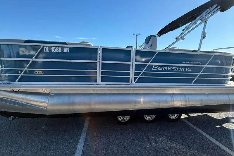 Slide: The Image of 2025 Berkshire 22RFX LE 2.75 pontoon boat, saltwater edition, parked on asphalt. - 15