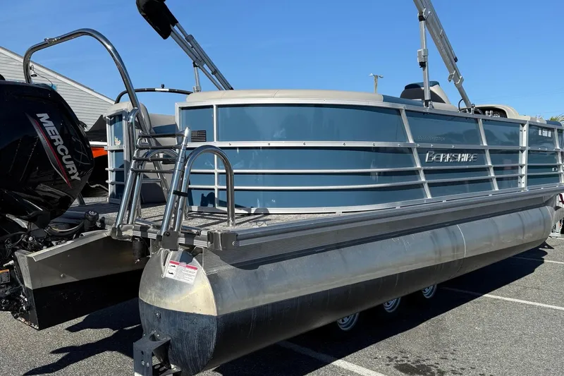 Slide: The Image of 2025 Berkshire 22RFX LE 2.75 pontoon boat with Mercury engine, parked outdoors. - 18