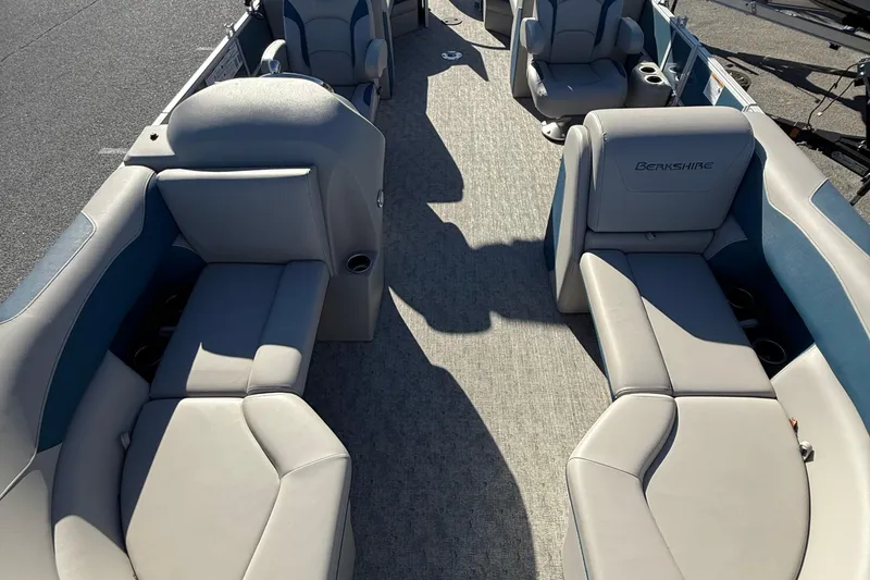 Slide: The Image of 2025 Berkshire 22RFX LE 2.75 pontoon boat interior with plush seating and cup holders. - 19