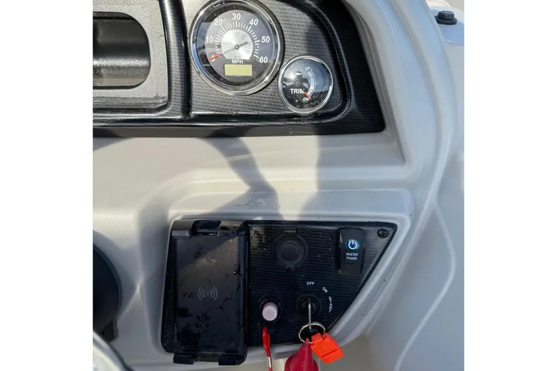 Slide: The Image of Dashboard of 2025 Berkshire 24CL 2.75 LE boat with speedometer and controls. - 16