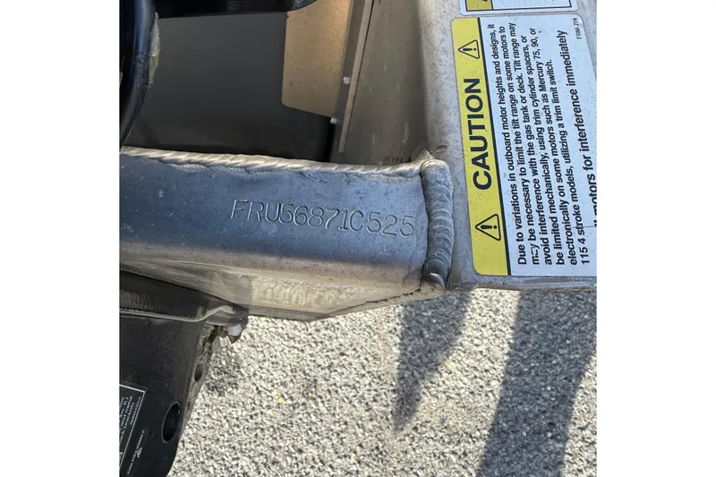 Slide: The Image of Close-up of Berkshire 24CL 2.75 LE 2025 boat serial number and caution label. - 18