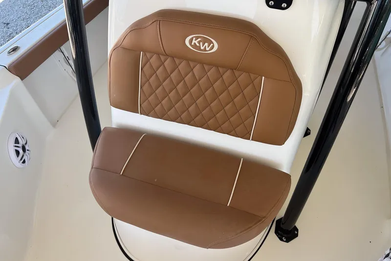 Slide: The Image of Brown cushioned seat on 2026 Key West 230 Bay Reef boat, featuring diamond stitching and KW logo. - 16