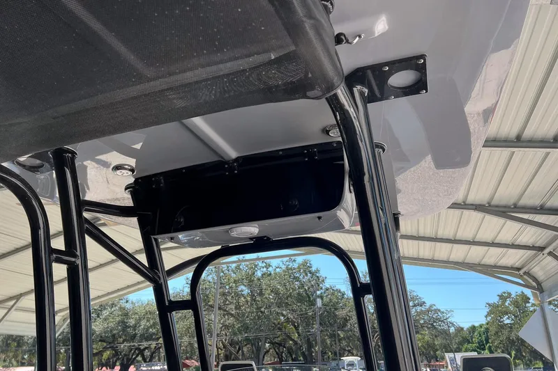 Slide: The Image of 2026 Key West 230 Bay Reef boat T-top structure under a metal canopy. - 24