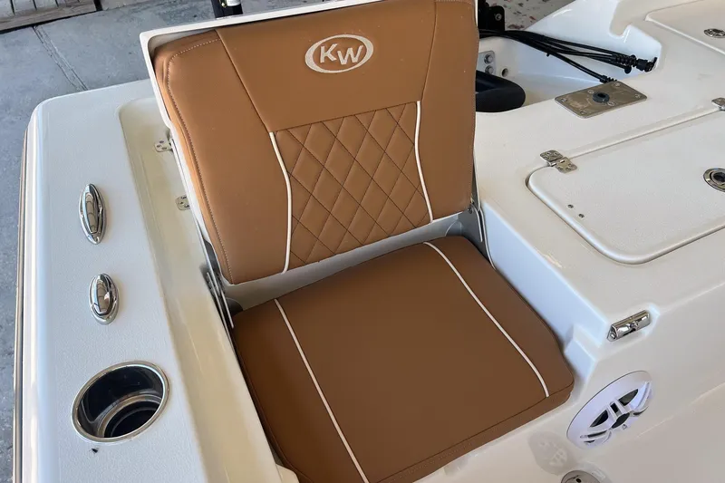 Slide: The Image of Brown cushioned seat on 2026 Key West 230 Bay Reef boat, featuring diamond stitching. - 30