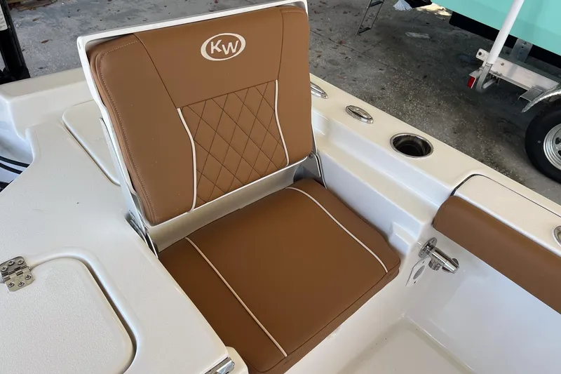 Slide: The Image of Brown cushioned seat on 2026 Key West 230 Bay Reef boat, featuring KW logo. - 32
