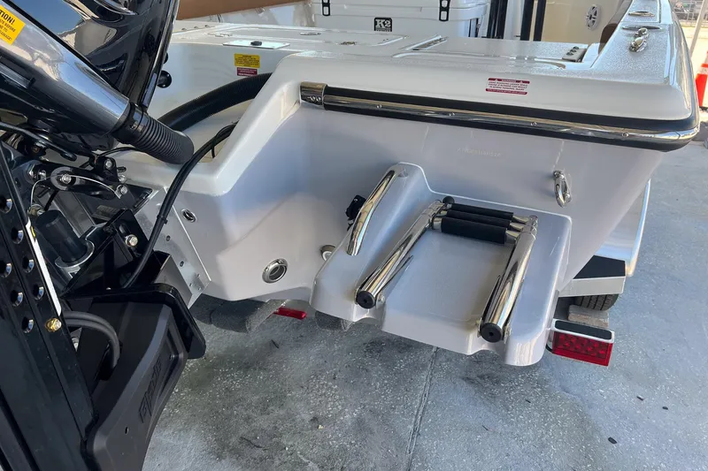 Slide: The Image of 2026 Key West 230 Bay Reef boat with rear ladder and motor details. - 6