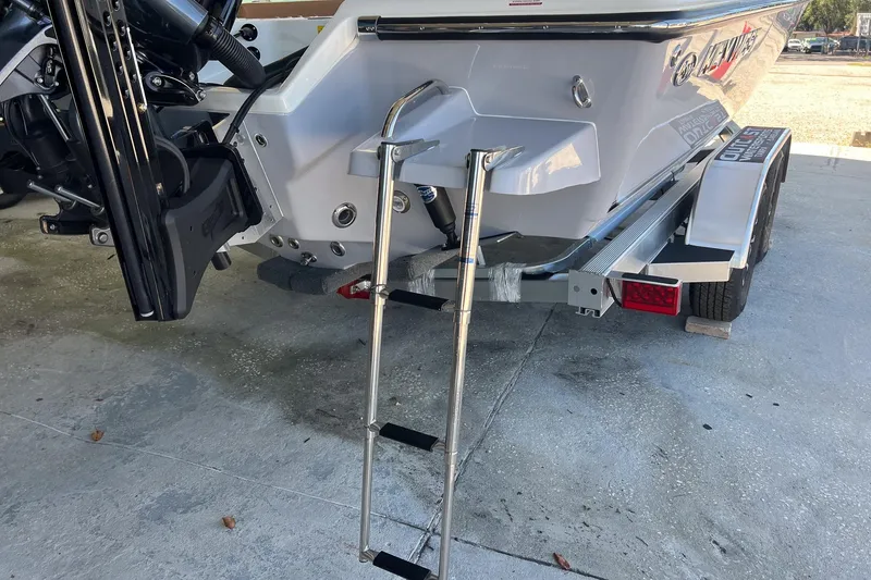 Slide: The Image of 2026 Key West 230 Bay Reef boat with ladder and trailer, rear view. - 7