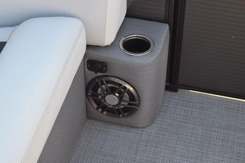 Slide: The Image of 2024 Crest Classic LX 220 SLC boat interior with speaker and cup holder detail. - 10