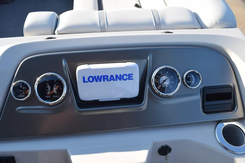 Slide: The Image of 2024 Crest Classic LX 220 SLC dashboard with Lowrance display and gauges. - 11