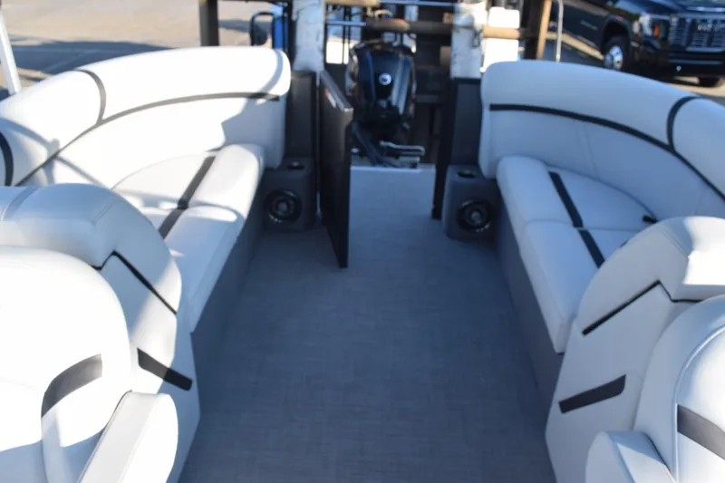 Slide: The Image of 2024 Crest Classic LX 220 SLC boat interior with plush seating and modern design. - 13