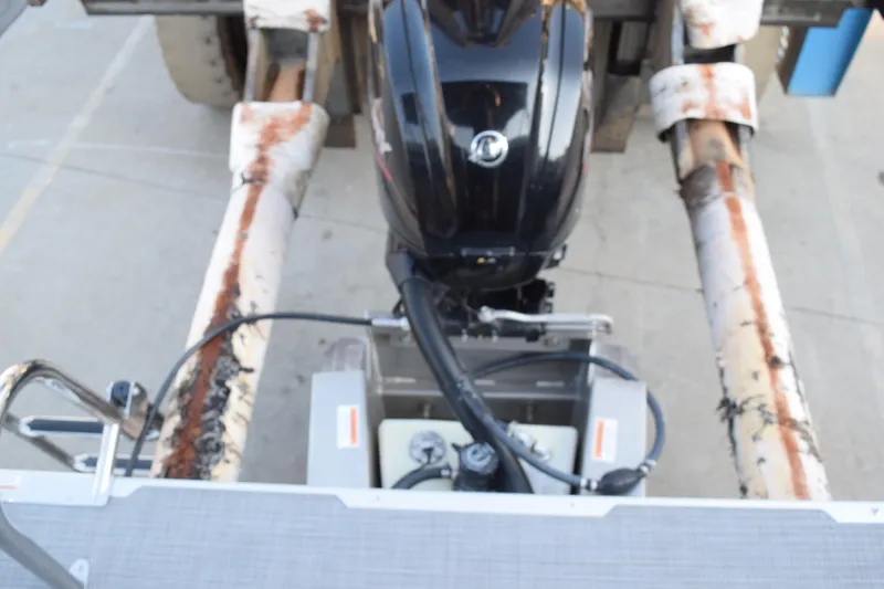 Slide: The Image of 2024 Crest Classic LX 220 SLC boat engine on a trailer, viewed from above. - 16