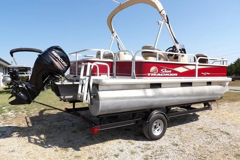 Slide: The Image of 2018 Sun Tracker BASS BUGGY® 18 DLX pontoon boat with Mercury outboard motor on trailer. - 10