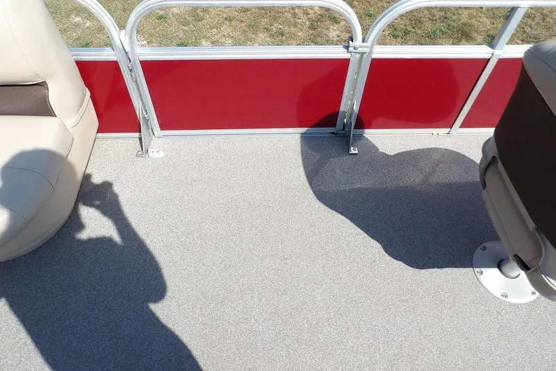 Slide: The Image of 2018 Sun Tracker BASS BUGGY® 18 DLX interior with beige seats and red paneling. - 11