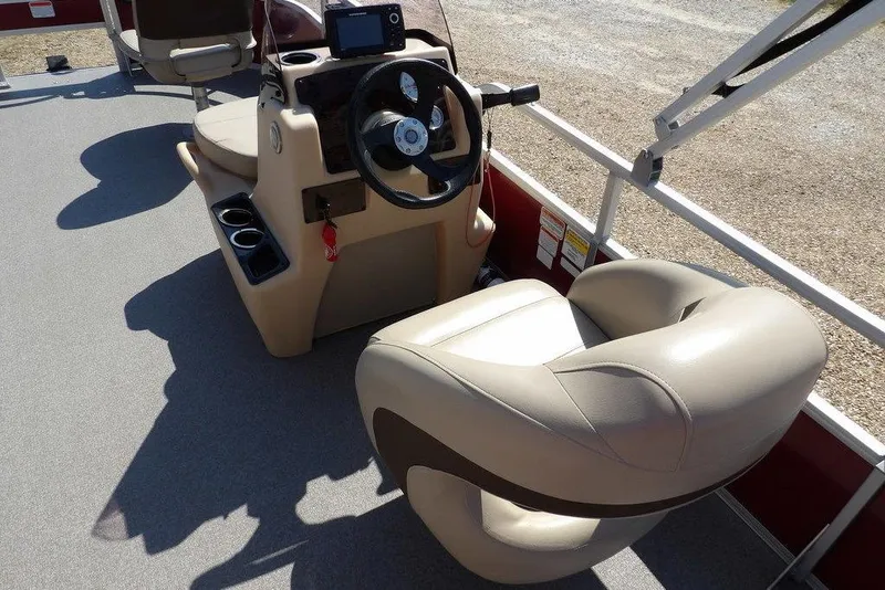 Slide: The Image of 2018 Sun Tracker BASS BUGGY® 18 DLX boat interior with steering console and seating. - 16