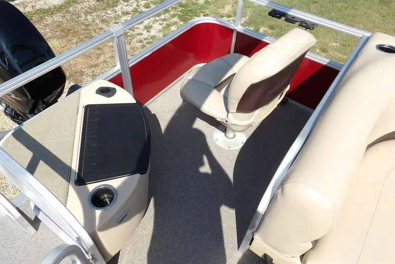Slide: The Image of 2018 Sun Tracker BASS BUGGY® 18 DLX interior with beige seating and red paneling. - 23