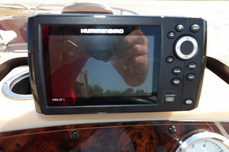 Slide: The Image of Humminbird Helix 5 fish finder on 2018 Sun Tracker BASS BUGGY® 18 DLX dashboard. - 25
