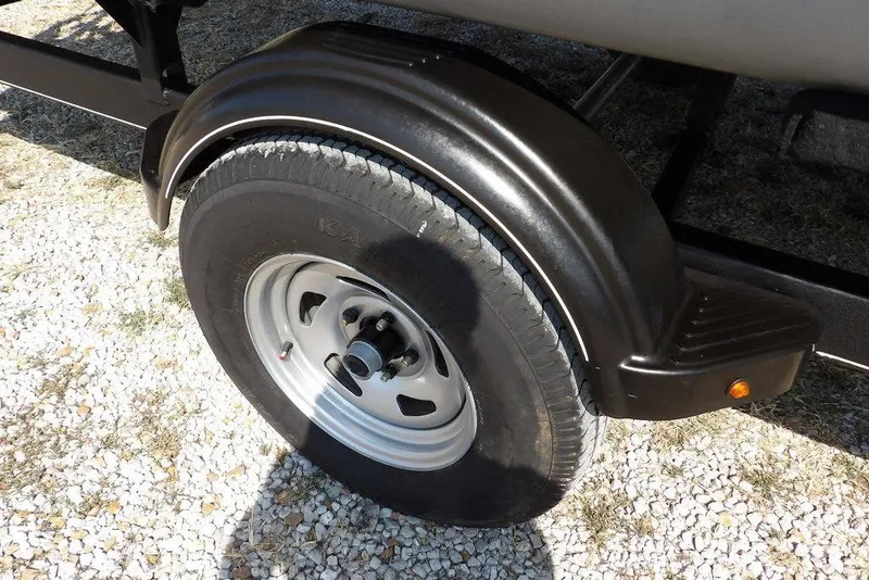 Slide: The Image of Trailer wheel of 2018 Sun Tracker BASS BUGGY® 18 DLX on gravel surface. - 31