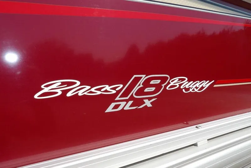 Slide: The Image of 2018 Sun Tracker BASS BUGGY® 18 DLX logo on red background. - 35