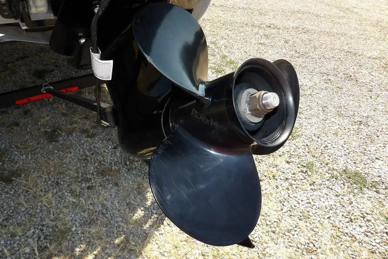 Slide: The Image of Propeller of 2018 Sun Tracker BASS BUGGY® 18 DLX on gravel surface. - 36