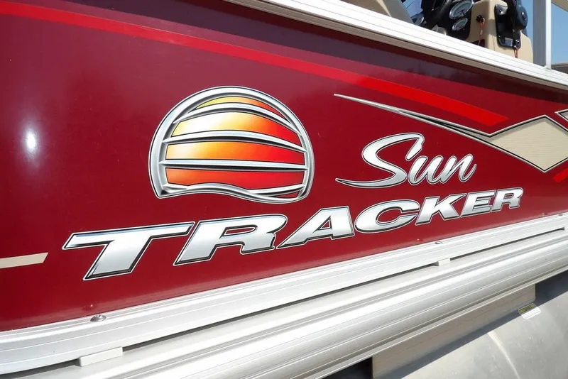 Slide: The Image of 2018 Sun Tracker BASS BUGGY® 18 DLX logo on red boat exterior. - 40