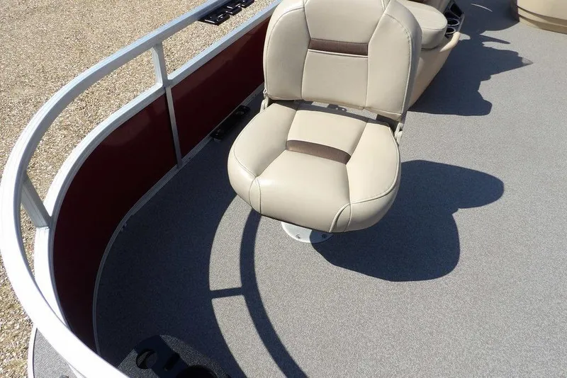 Slide: The Image of 2018 Sun Tracker BASS BUGGY® 18 DLX boat seat with beige upholstery and red railing. - 7