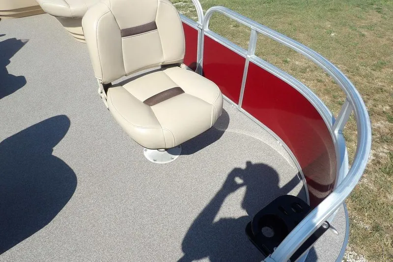 Slide: The Image of 2018 Sun Tracker BASS BUGGY® 18 DLX boat seat with red paneling and shadow. - 8