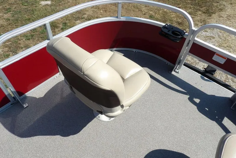 Slide: The Image of 2018 Sun Tracker BASS BUGGY® 18 DLX boat seat with red paneling and cup holder. - 9