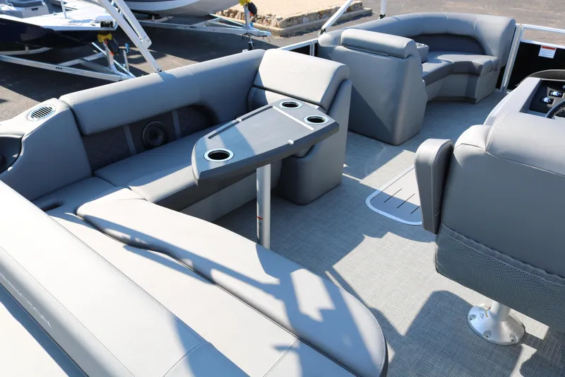 Slide: The Image of 2026 Bennington 22SX Stern Radius boat interior with gray cushioned seating. - 15