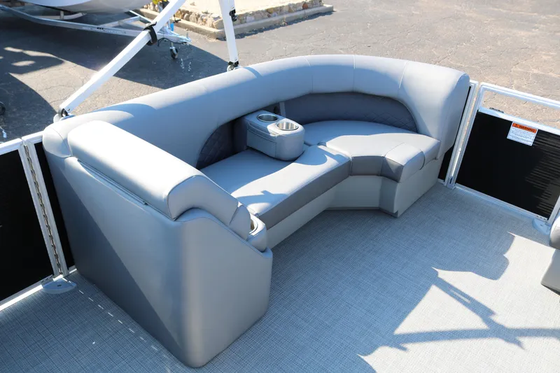 Slide: The Image of 2026 Bennington 22SX Stern Radius boat seating, featuring sleek gray upholstery. - 17