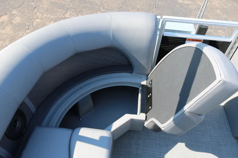 Slide: The Image of 2026 Bennington 22SX Stern Radius boat interior with open storage compartment. - 25