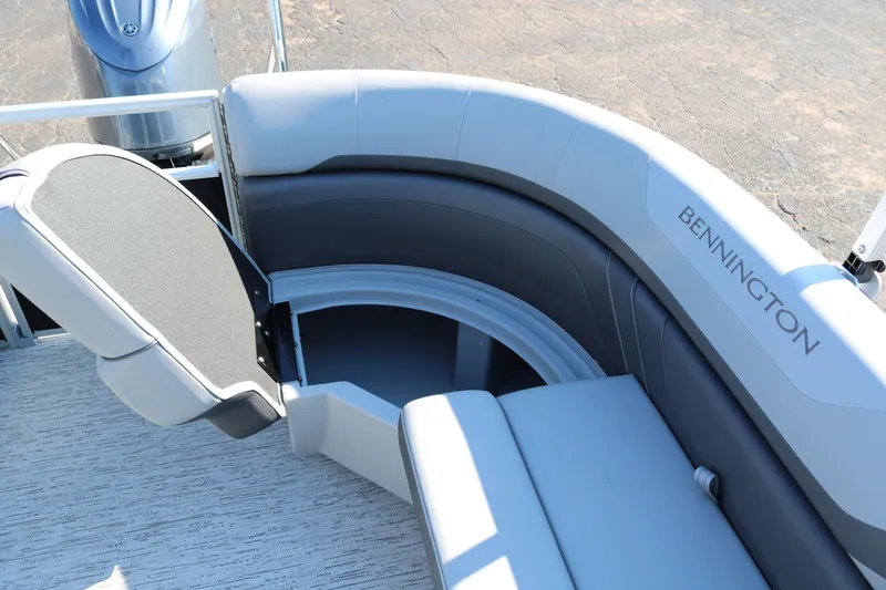 Slide: The Image of 2026 Bennington 22SX Stern Radius boat seating with storage compartment open. - 29