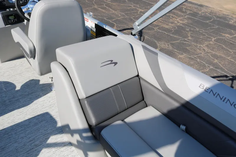 Slide: The Image of 2026 Bennington 22SX Stern Radius boat interior with gray seating and logo detail. - 31